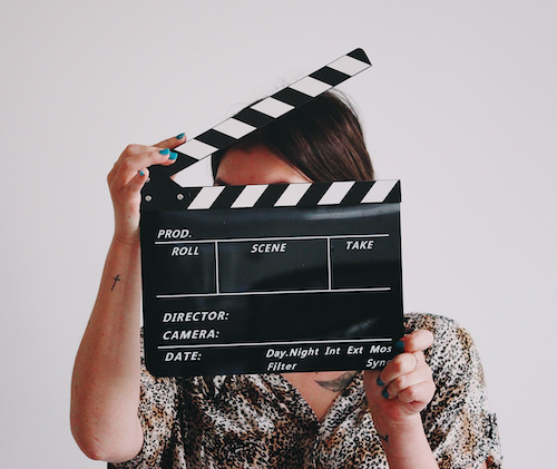 Woman with clapperboard